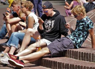 teenagers on mobile phones