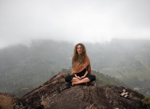 Woman meditating, achieving spiritual well-being