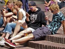 teenagers on mobile phones