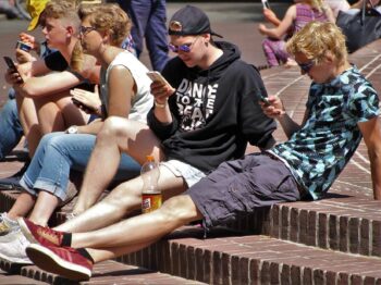 teenagers on mobile phones